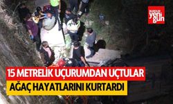 15 metrelik uçurumdan uçtular, hayatlarını ağaç kurtardı