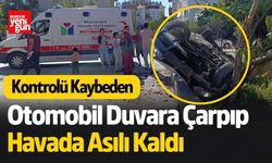 Otomobil Duvara Çarpıp Havada Asılı Kaldı