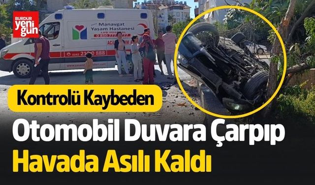 Otomobil Duvara Çarpıp Havada Asılı Kaldı